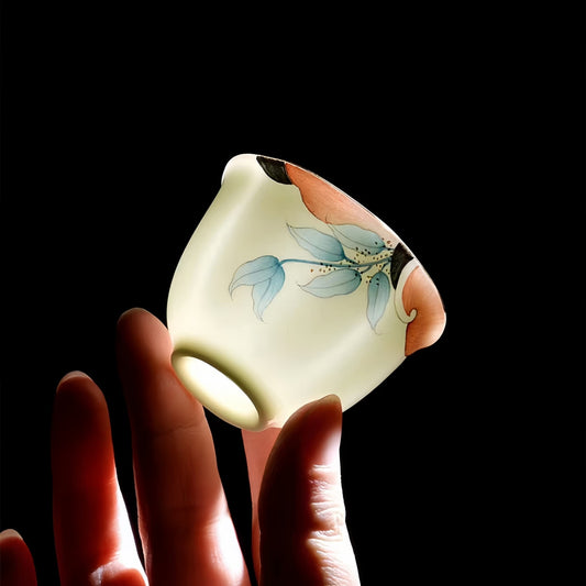 YUNGPING Garden Memory Tea Set close-up against light showcasing bone china translucency and 45% bone ash content