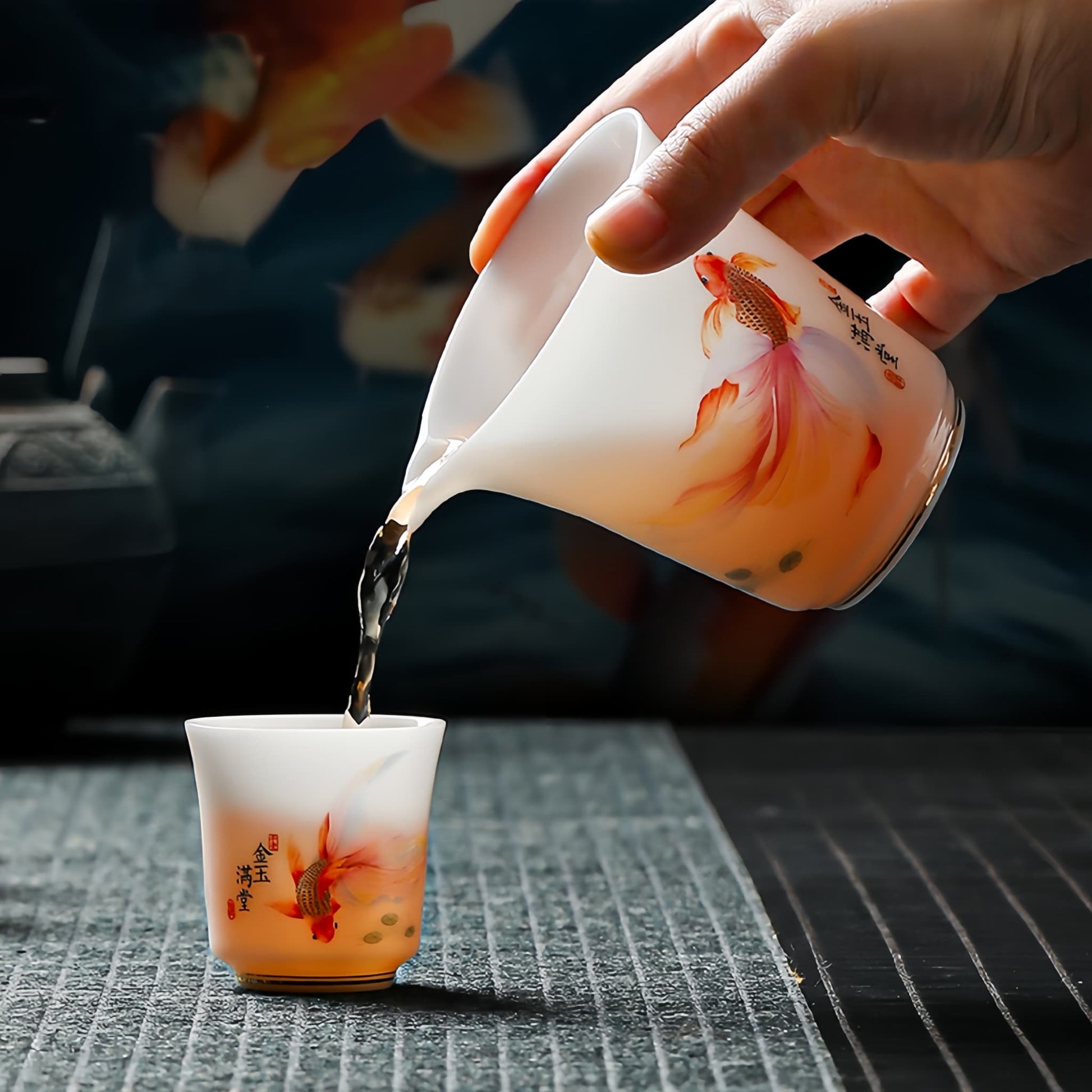 Tea being poured from a decorative teapot into a matching cup,  YUNGPING Abundant Fortune Icy Jade Porcelain Kunfu Tea Set, 10-Piece