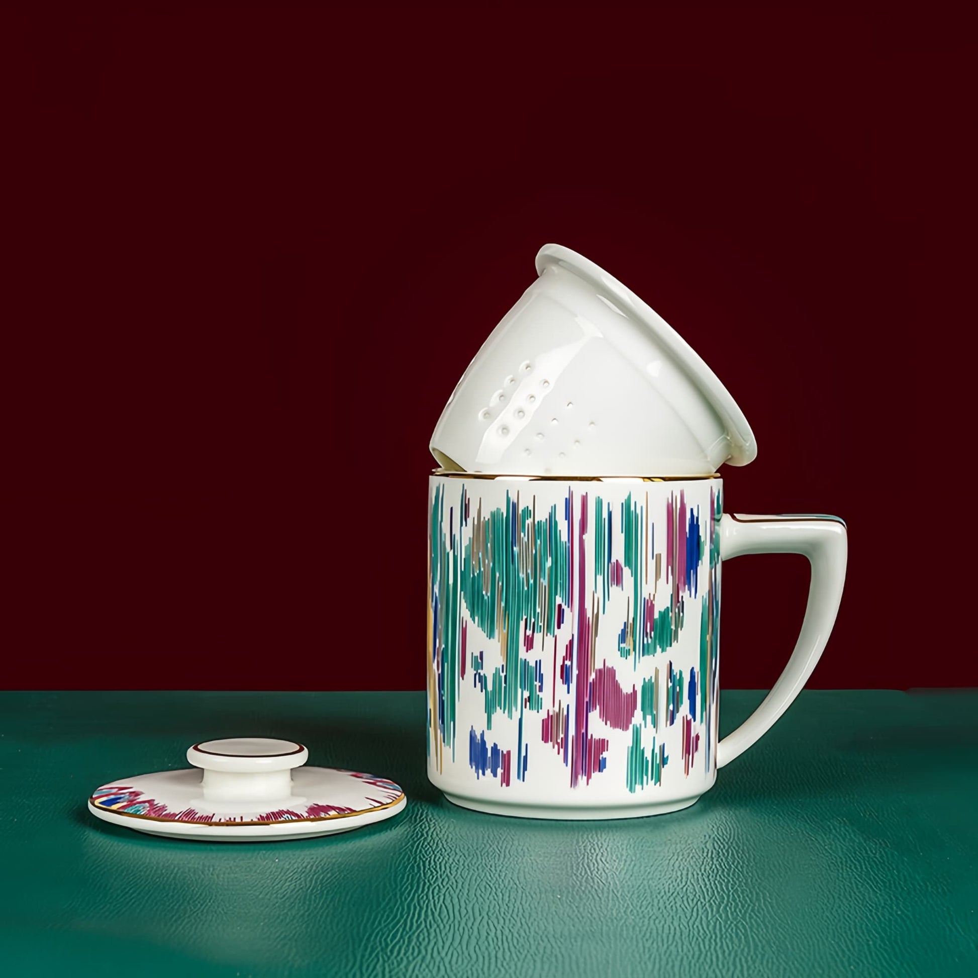 YUNGPING Artistic Lens Fine Bone China Infuser Tea Mug, 3-Piece, styled for a casual afternoon tea.