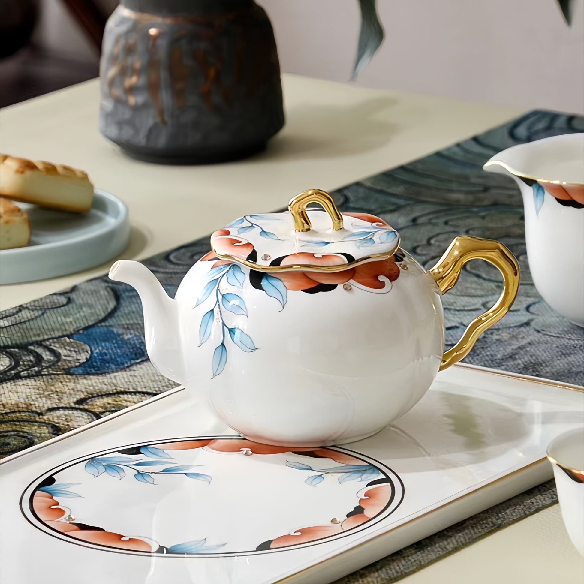 Decorative teapot with floral design on a table setting, YUNGPING Autumn Garden Memory Fine Bone China Tea Set, Close-up detail