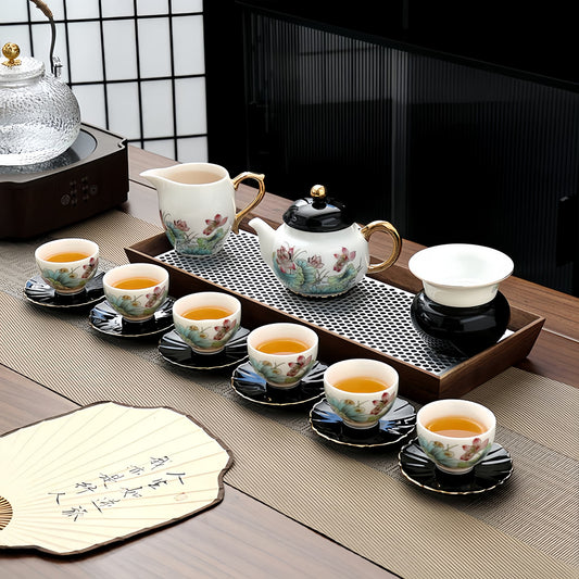 Tea set with teapot, cups, and saucers on a wooden tray. YUNGPING Elegant Lotus Jade Cream Porcelain Kungfu Tea Set, 16-Piece