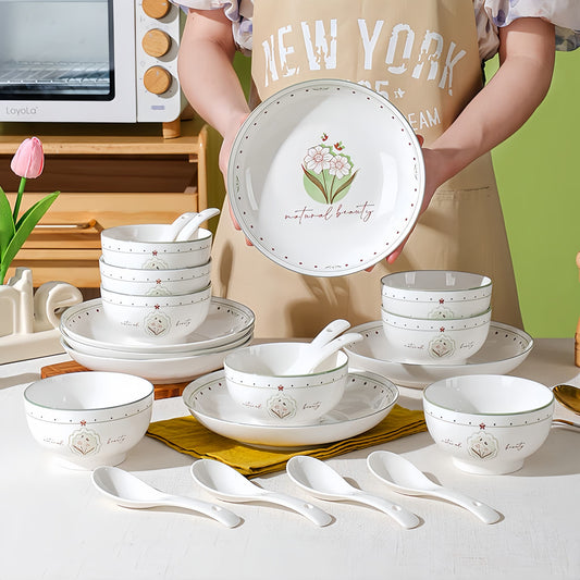 Set of white ceramic dishes with floral designs on a kitchen counter. YUNGPING Floral Language Everyday Ceramic Dinnerware Set, 22-Piece