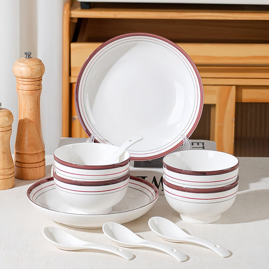 Ceramic dinnerware set with red stripes on a white surface, wooden cabinet in the background. YUNGPING Futura Everyday Ceramic Dinnerware Set, 10-Piece