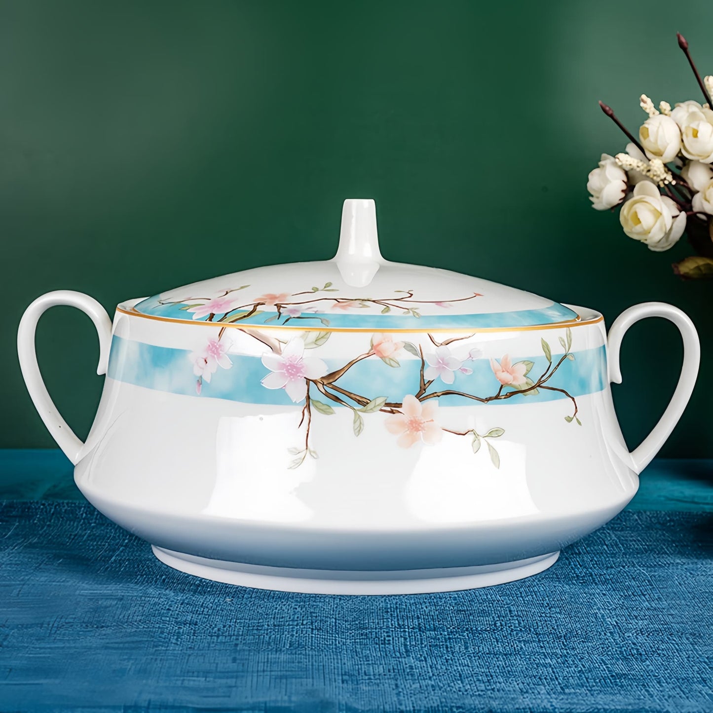 Decorative teapot with floral design on a blue surface, YUNGPING Peach Blossom Veil2 Fine Bone China Dinnerware Set, Close-up detail
