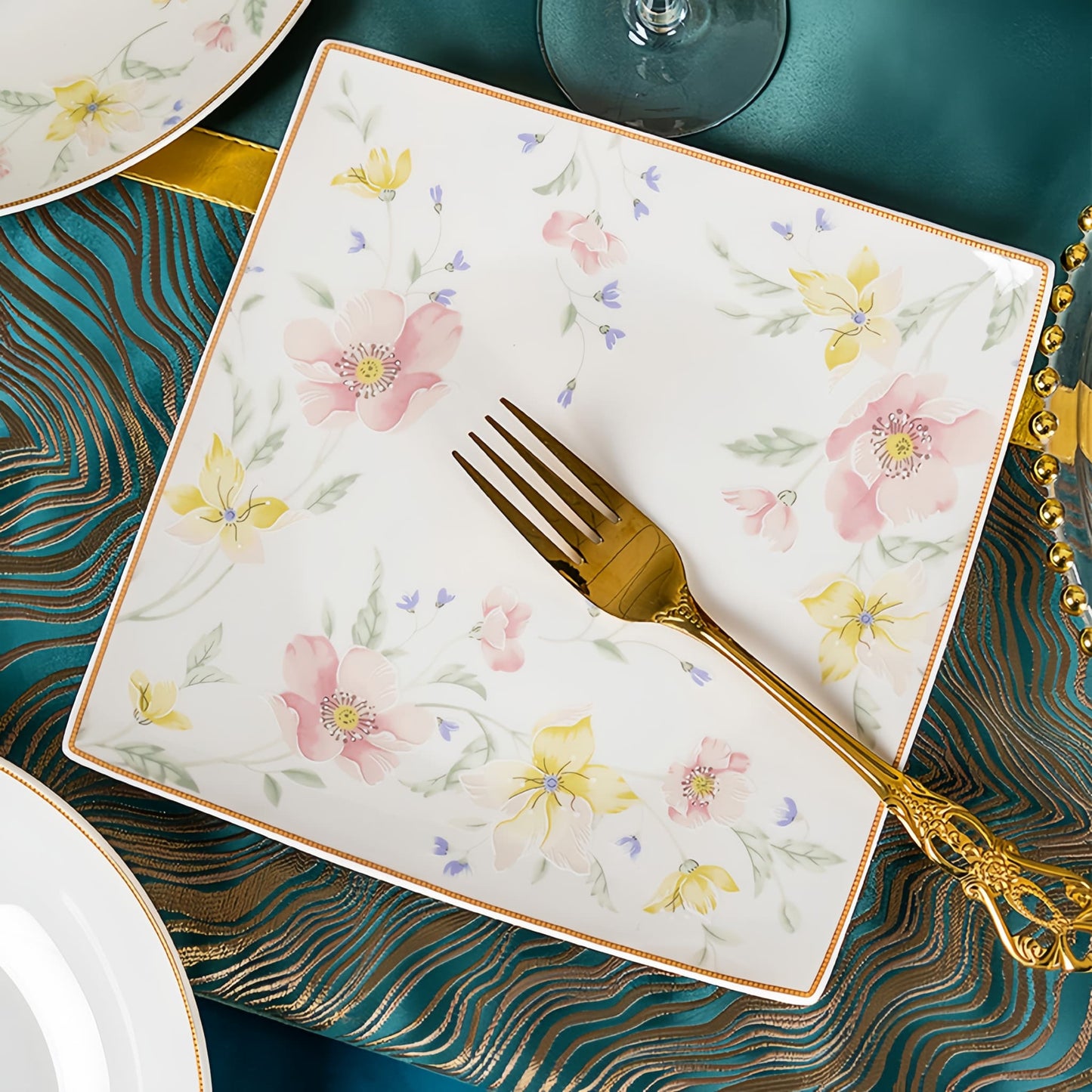 Floral-patterned plate with a gold fork on a decorative tablecloth, YUNGPING Spring Bloom Breeze Fine Bone China Dinnerware Set, Close-up detail